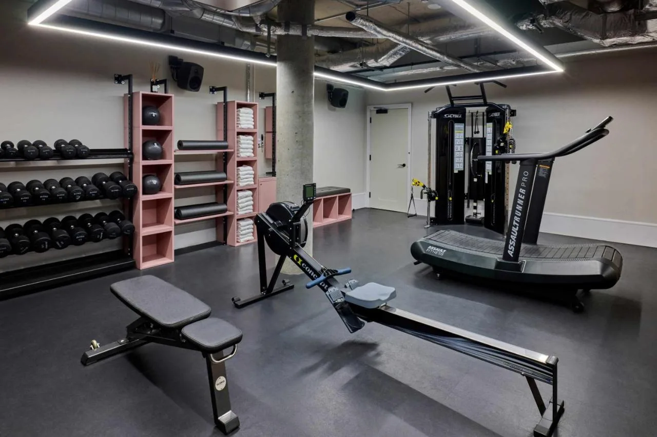 a gym with two treadmills and a treadmill at Turing Locke Cambridge in Cambridge