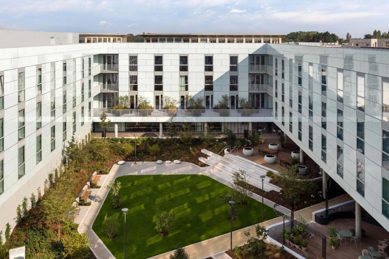 an aerial view of a building with a courtyard at Turing Locke Cambridge in Cambridge